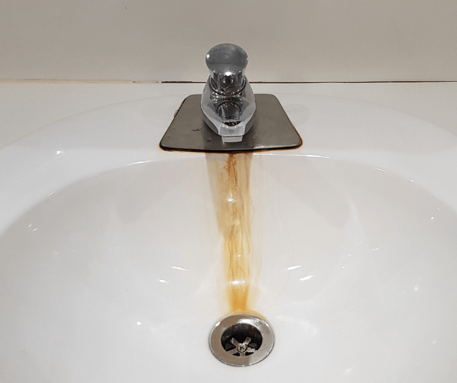 sink and faucet with rust stains from iron oxidation