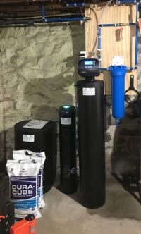 1 1/2 cubic feet Water Softener with PFAS removal system (shorter black tank with green illumination) and 20