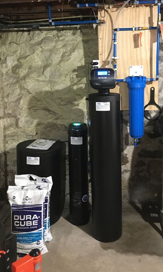 1 1/2 cubic feet Water Softener with PFAS removal system (shorter black tank with green illumination) and 20" "big blue" 5-micron graded density sediment pre-filter.