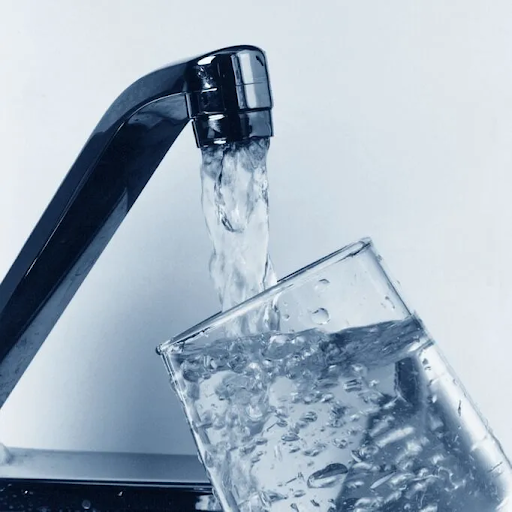 unnamed (5) water pouring from the faucet into a clear glass