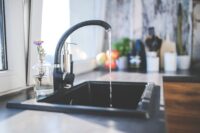 Water flowing from sink faucet