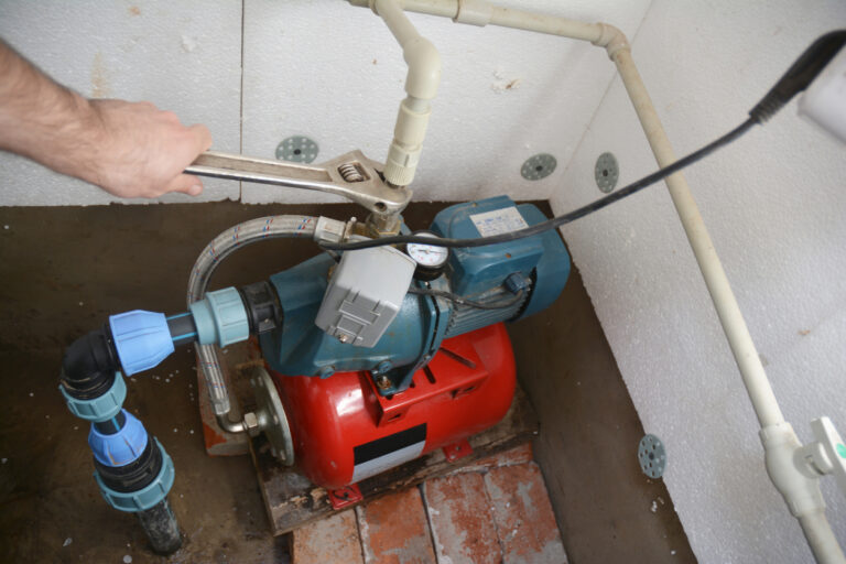 Contractor installing and repairing water pumping station.